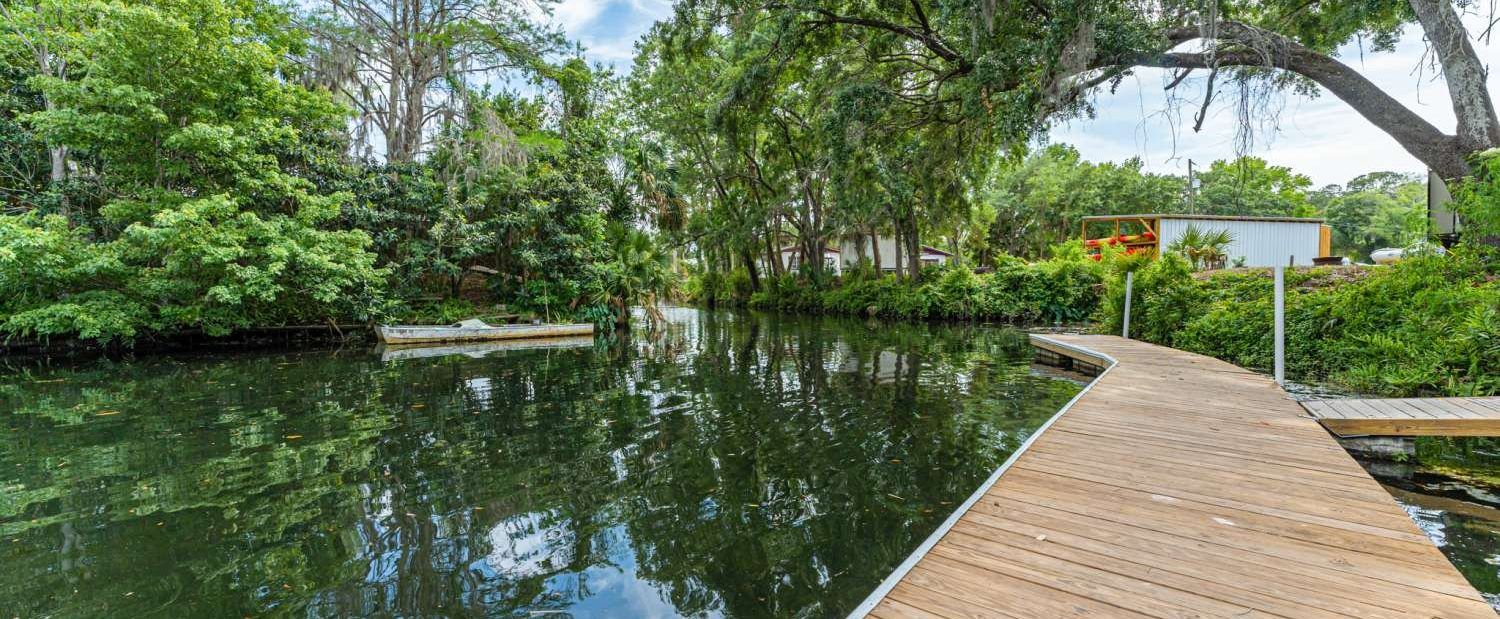 The floating dock on the canal at Seven Sisters Campground, under live oaks