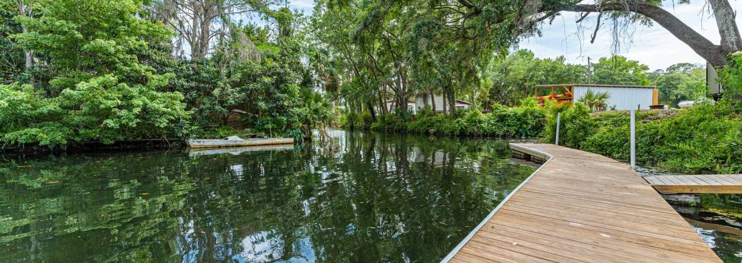 The floating dock on the canal at Seven Sisters Campground, under live oaks